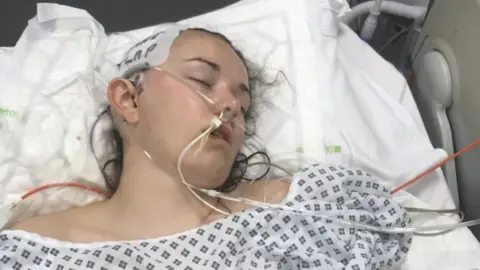 Family image Cara in hospital in coma after surgery