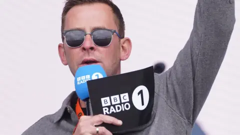 PA Media Scott Mills on the main stage during BBC Radio 1's Big Weekend in Coventry in May