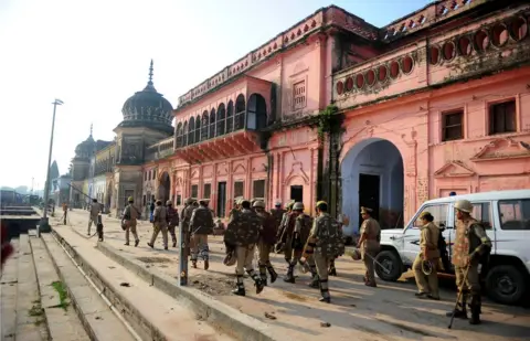 Getty Images Indian police on patrol near a temple in Ayodhya in 2013