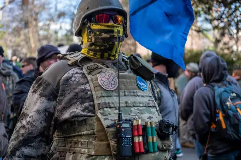 Joel Gunter A gun rights activist defies Virginia's no masking law at the Lobby Day rally