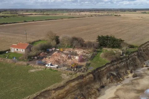 Martin Barber/BBC Aerial view of Easton Bavents houses