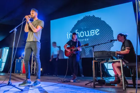 BBC/Alamy InHouse graduates performing at Latitude