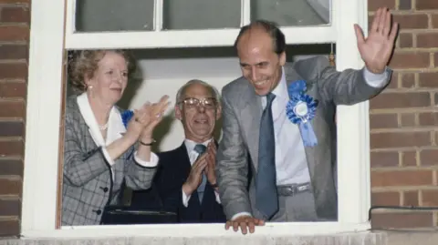 Getty Images Norman Tebbit celebrates the Conservative party's 1987 election victory, watched by Margaret and Denis Thatcher