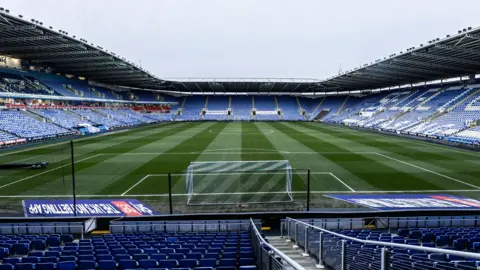 Getty Images A general view of the inside of the SCL Stadium in Reading, a large sports stadium with predominantly blue seats, pictured on a dull day.