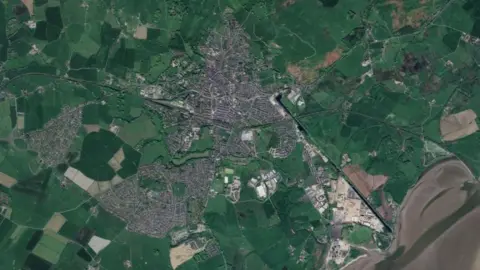 GOOGLE A map looking at Ulverston and its surrounding area, showing green land surrounding a grey amount of urban structures