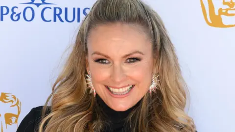 Mel Schilling smiling at the Baftas in May 2025