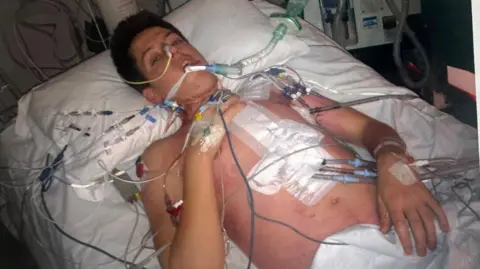 Rhys Llewellyn Rhys in a hospital bed after a transplant 