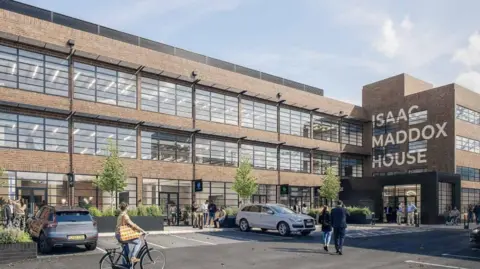 ADP Architecture The outside of Shrub Hill Quarter building which is full of windows and has cars parked in front. A cyclist is using the road and holding a bag