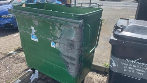 A green recycling bin in Stevenage