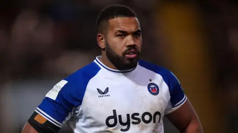 Ollie Lawrence standing on the field during a Bath match this season