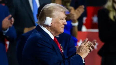 Donald Trump with a bandage on his ear