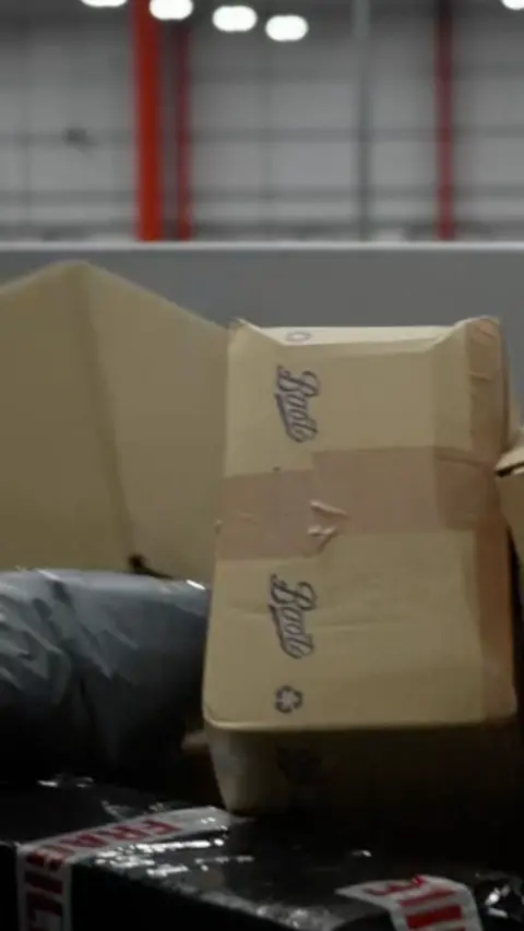 Parcels on a conveyor belt.