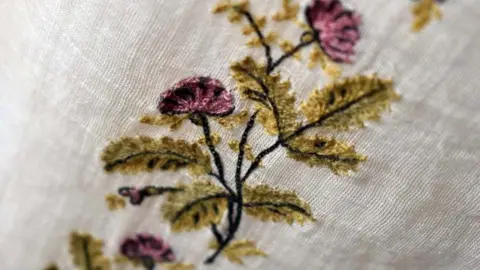 LCC Close up of thistle embroidery on Regency day dress from 1800-1810