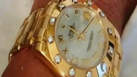 PA Media A diamond-encrusted Rolex watch