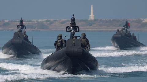Members of Taiwan's Navy navigate onboard special operation boats during a drill part of a demonstration for the media, to show combat readiness ahead of the Lunar New Year holidays, on the waters near a military base in Kaohsiung, Taiwan January 31, 2024.