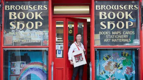 Browsers Bookshop Porthmadog Owner Sian Cowper in front of her bookshop in Porthmadog