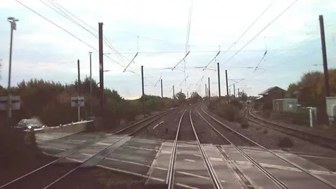 Hull Trains/RAIB View from a passenger train over train tracks at a signal box