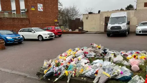 Floral tributes left at the scene of Harley Barfield's murder