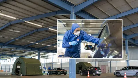 Getty Images Soldiers test people for coronavirus symptoms. March 25, 2020, Saarbruecken Germany