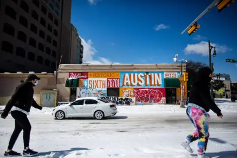 Montinique Monroe / Getty Images Pedestrians in Austin