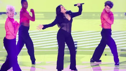 PHIL NOBLE/Reuters Mae Mueller in the dress rehersal for the Eurovision song contest