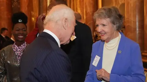 WPA via Getty Images Penelope Keith is shown in conversation with King Charles at a reception in 2024
