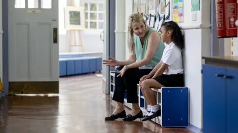 Getty Images Generic picture of teacher with student