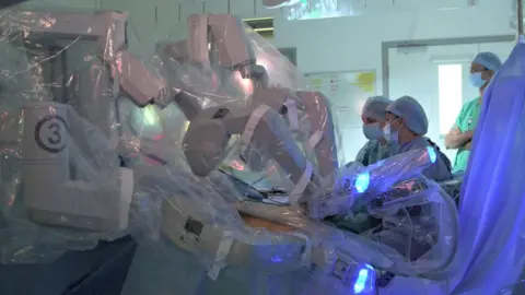 Cambridge University Hospitals NHS Trust Robot in operating theatre