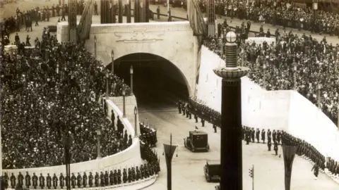 Merseytravel Crowds line the streets around the Queensway Tunnel entrance in 1934