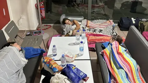 Michael Cochrane Michael Cochrane's daughter and other passengers slept in the airport on Thursday night