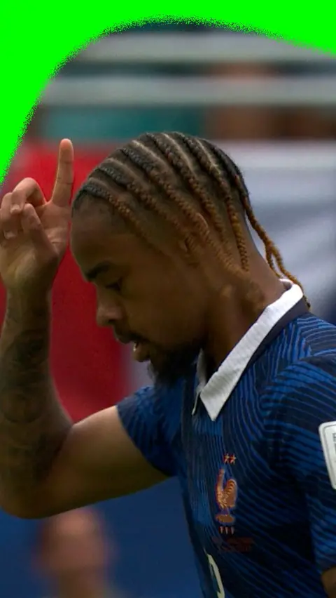 Bradley Barcola points to the sky to celebrate scoring a second goal for France in the 2026 World Cup third place final.