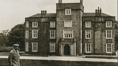 Fortune Series An historical photograph showing Winstanley Hall in Wigan. The image shows the intact three-storey building.