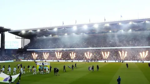 PA Media Villa Park. Fireworks go off as players walk out onto the pitch