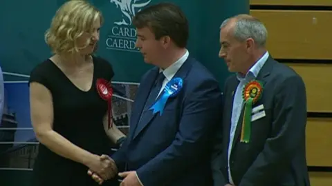 Anna McMorrin shakes hands with Craig Williams