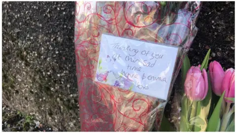 Floral tributes left at the scene