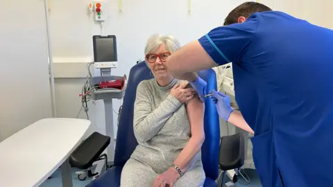 June Price getting an injection as part of the trial