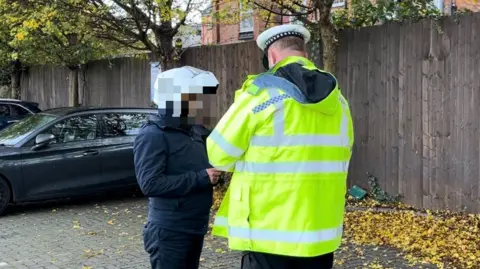 BBC PC Joshua Ace talking to an offending motorcyclist in Leicester