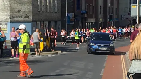 Tom The car parked up by the side of the road