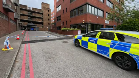 Another view of the scene watch outside the building.