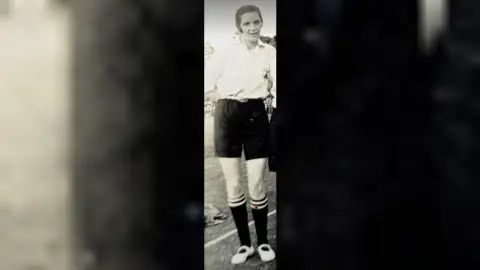 Lizzy Ashcroft Collection A black and white picture of a woman in a football kit.