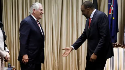 AFP Kenya's President Uhuru Kenyatta (R) greets U.S. Secretary of State Rex Tillerson and his delegation prior to a meeting at the State House in Nairobi, on 9 March 2018