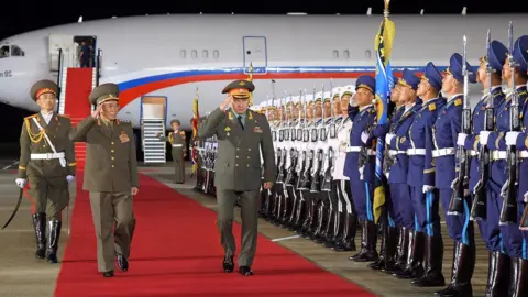 Reuters Russian Defence Minister Sergei Shoigu welcomed at an airport in Pyongyang on 25 July