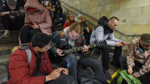 EPA Residents take shelter inside a metro station during an air raid alert in Kyiv (Kiev), Ukraine, 31 December 2022.