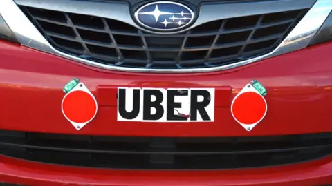 Getty Images Uber sign on car