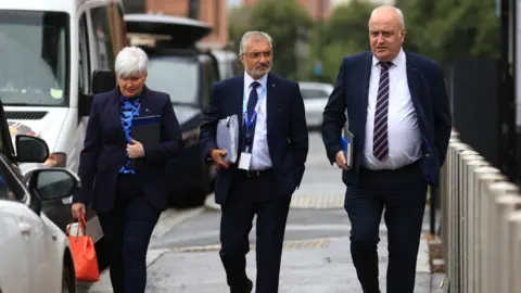 PA Media DUP Policing Board members Joanne Bunting (left) and Trevor Clarke (right) attended Thursday's meeting along with independent Policing Board member Mukesh Sharma