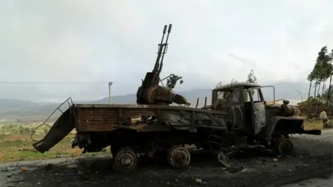 Reuters A machine gun mounted in a burnt-out truck on the road to Abiy Addi town in Ethiopia, July 10, 2021. The area saw fierce fighting between Ethiopia"s military and Tigrayan forces