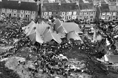 PA Rescuers digging for trapped children after the slap heap engulfed Pantglas Junior School