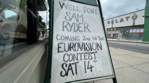 Richard Smith/BBC Sign about Sam Ryder in Maldon