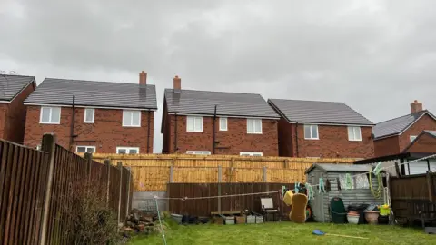 A picture of houses overlooking neighbours' gardens