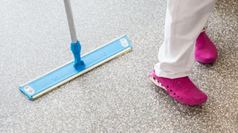 Alamy Hospital cleaner